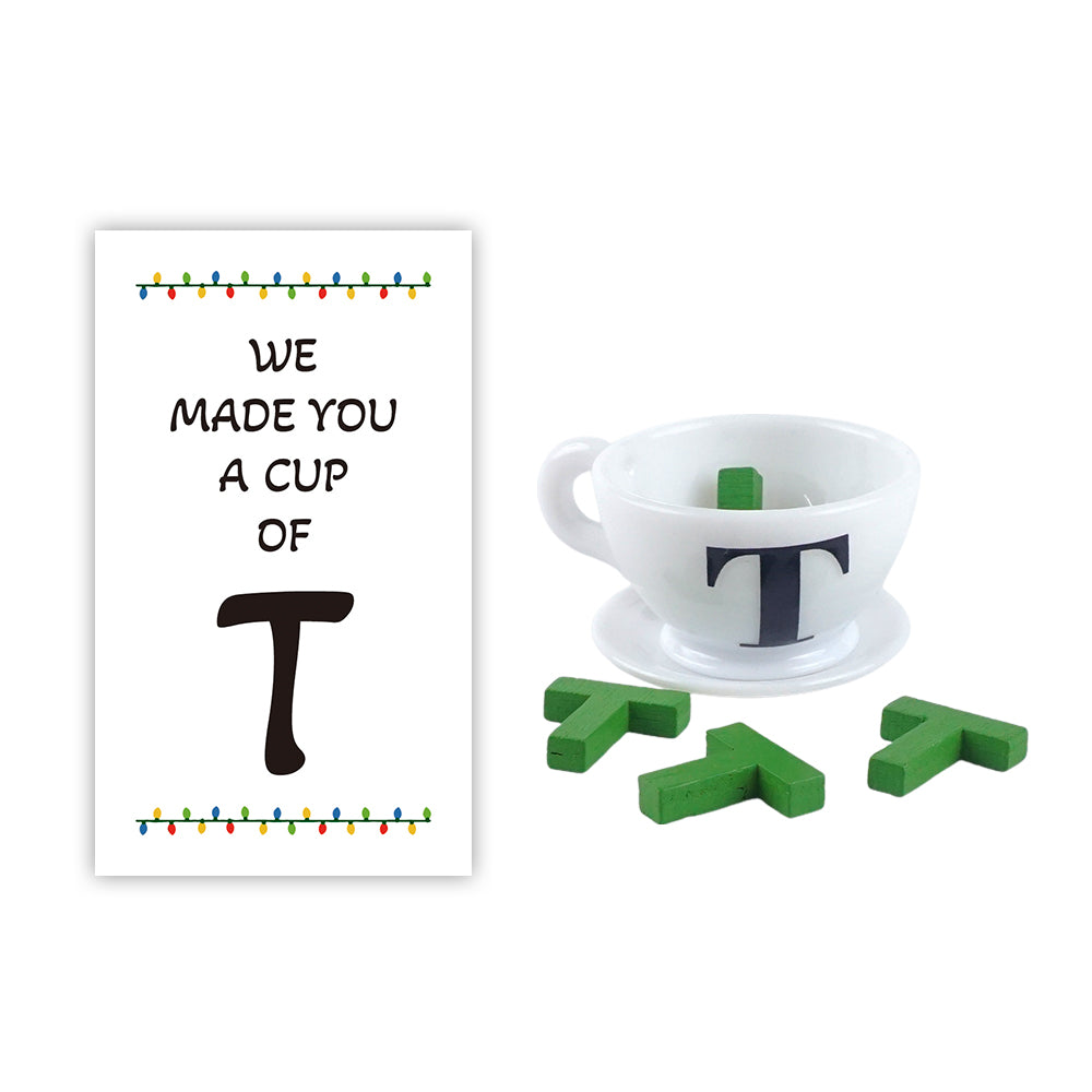 Christmas elf prop set with mini teacup, letter T pieces, and card for a holiday elf display.