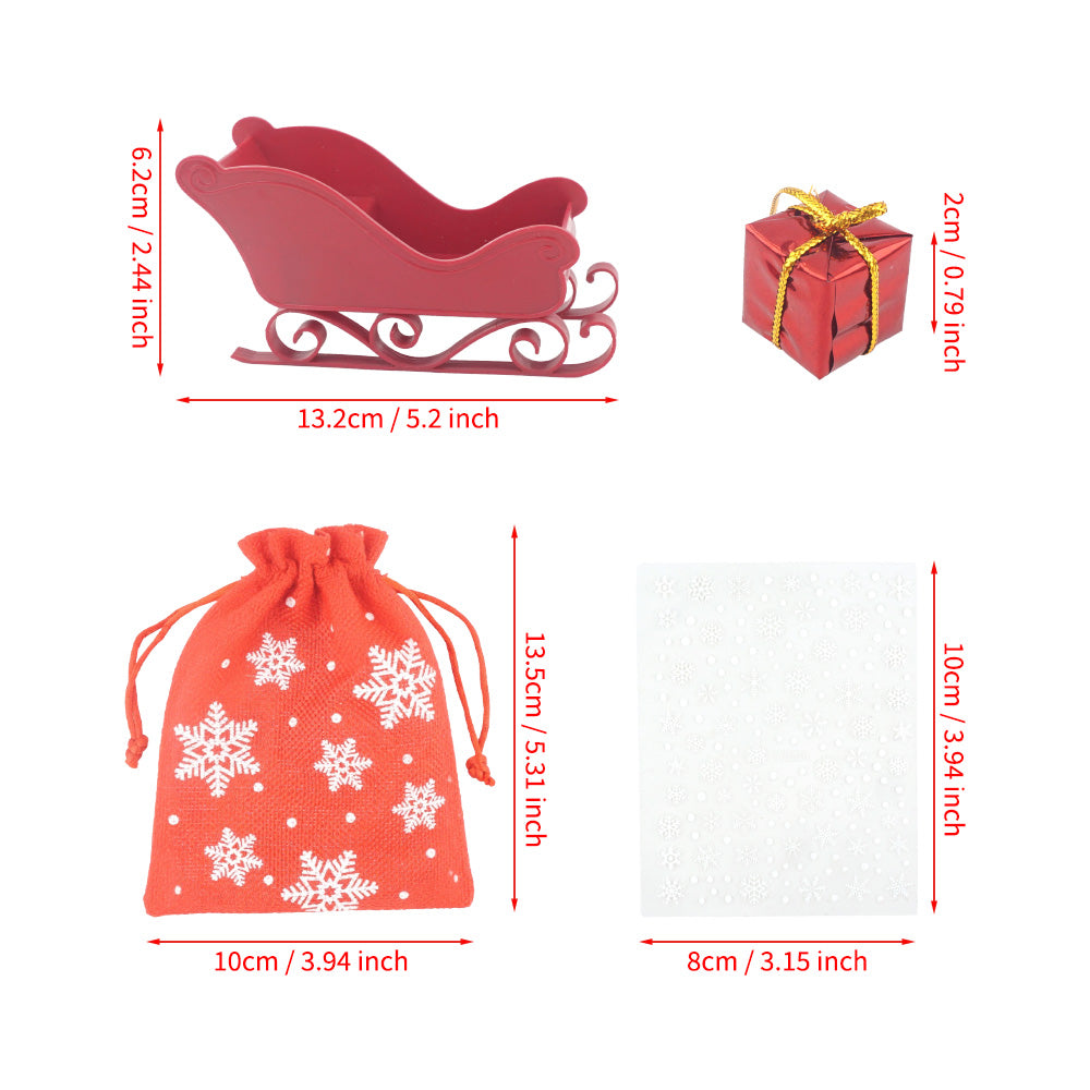 Christmas elf prop set with red sleigh, gift bag, mini gift boxes, snowflake stickers, and activity card for holiday elf scene display
