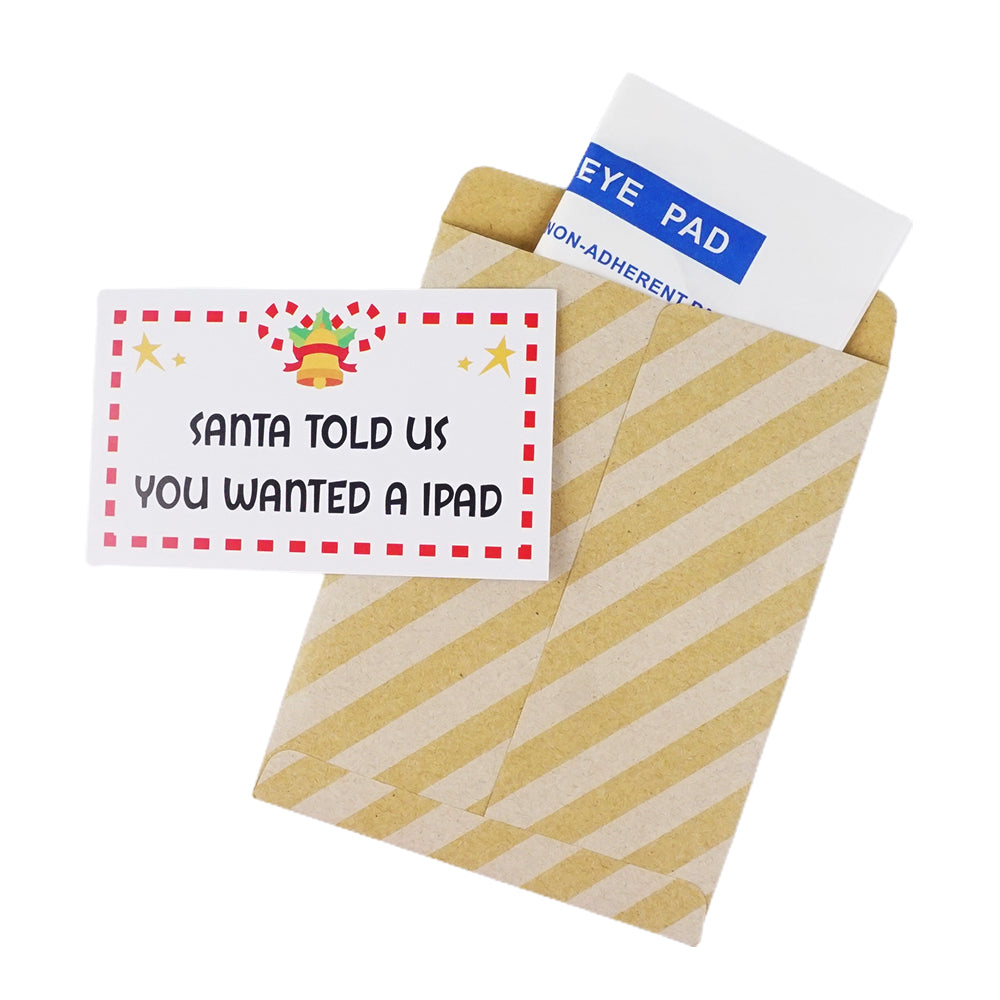 Christmas elf prop set with eye pad packet, paper envelope, and prank card for a holiday elf display.