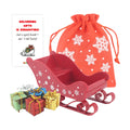 Christmas elf prop set with red sleigh, gift bag, mini gift boxes, snowflake stickers, and activity card for holiday elf scene display