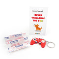Christmas elf prop set with game controller keychain, bandage strips, and activity card for holiday elf scene display