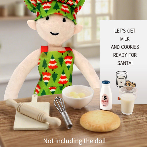 Christmas elf prop set with chef hat, apron, baking tools, milk, dough, and activity card.
