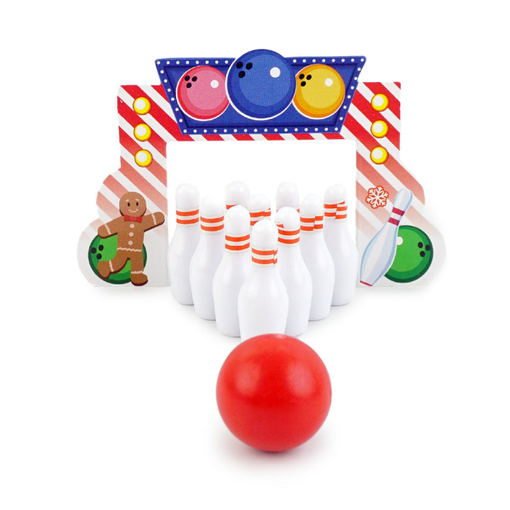 Christmas elf prop set with bowling backdrop, pins, and ball for a holiday elf display.