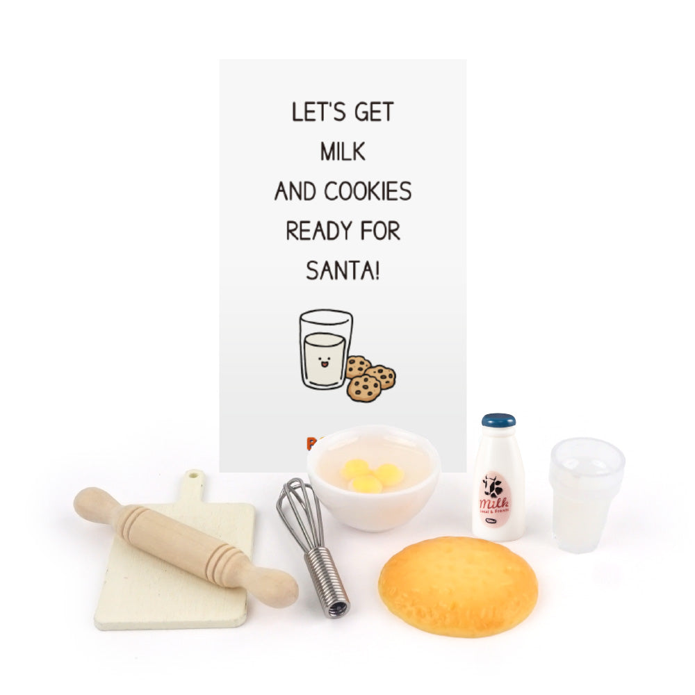 Christmas elf prop set with chef hat, apron, baking tools, milk, dough, and activity card.