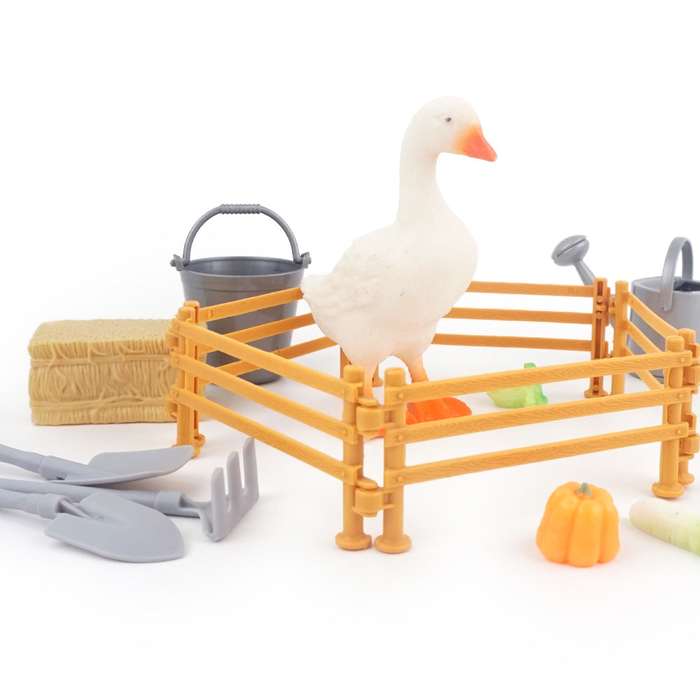 Christmas elf prop set with farm fence, wheelbarrow, tools, mini vegetables, goose figure, and activity card for holiday elf scene display