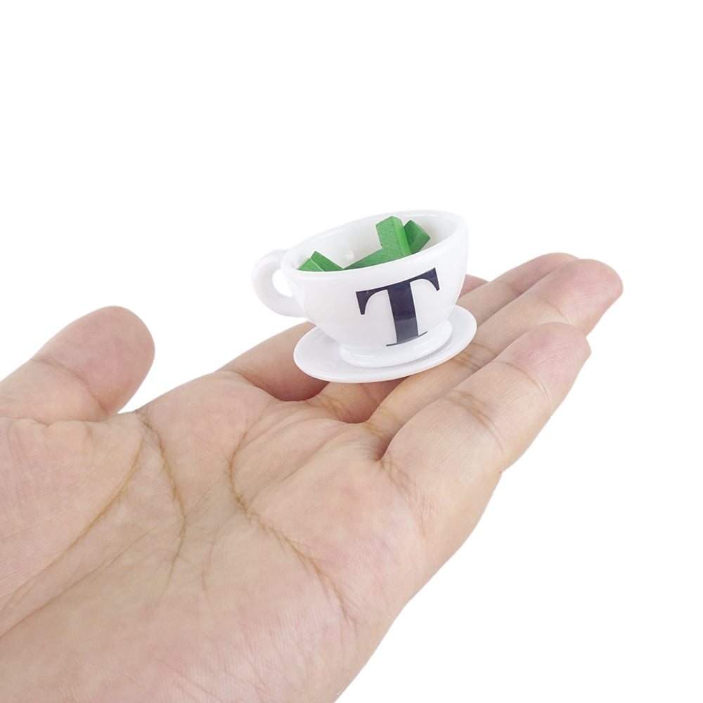 Christmas elf prop set with mini teacup, letter T pieces, and card for a holiday elf display.
