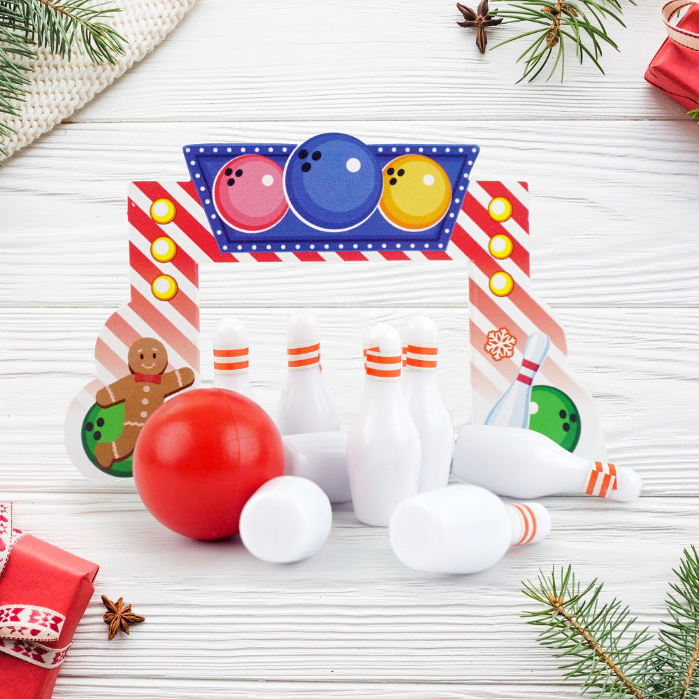 Christmas elf prop set with bowling backdrop, pins, and ball for a holiday elf display.