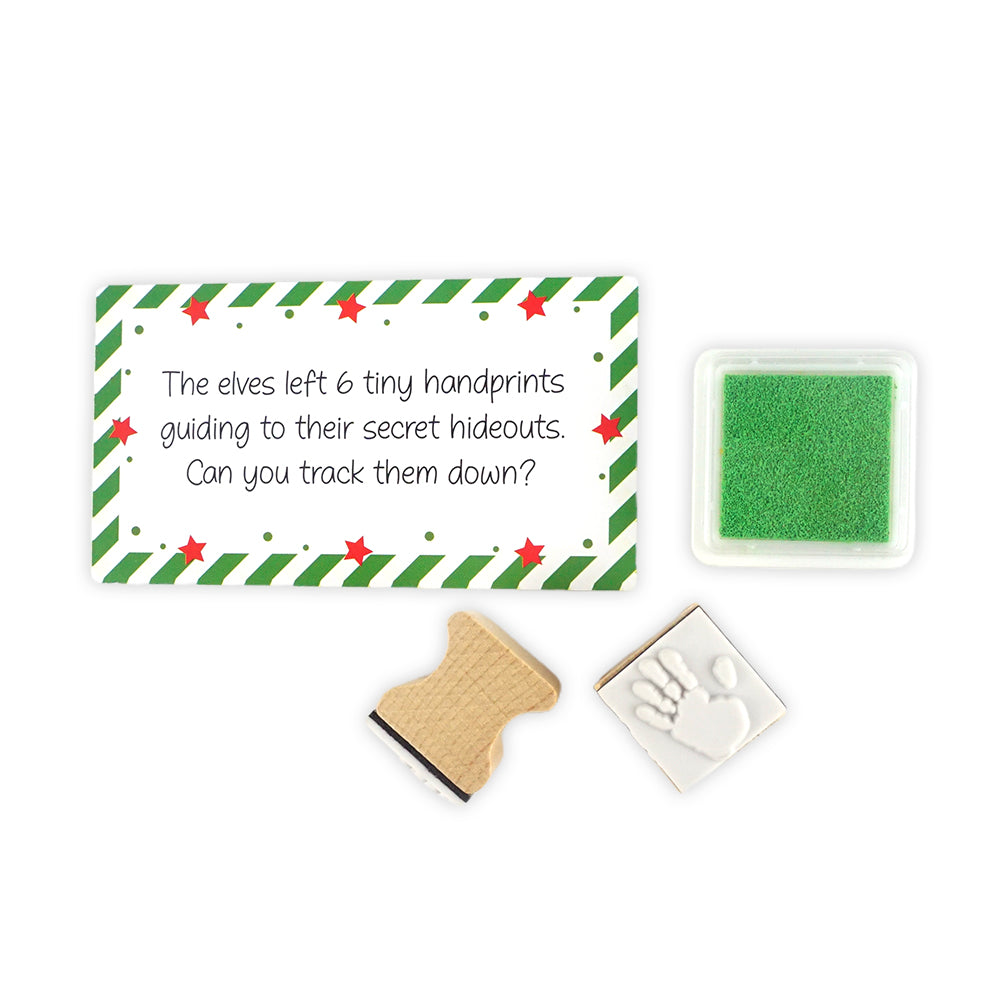 Christmas elf prop set with handprint stamps, red ink pad, and activity card for a holiday elf display.
