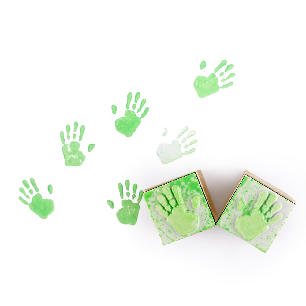 Christmas elf prop set with handprint stamps, red ink pad, and activity card for a holiday elf display.
