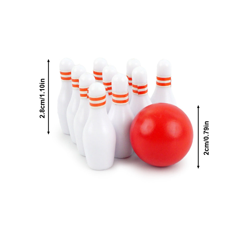Christmas elf prop set with bowling backdrop, pins, and ball for a holiday elf display.