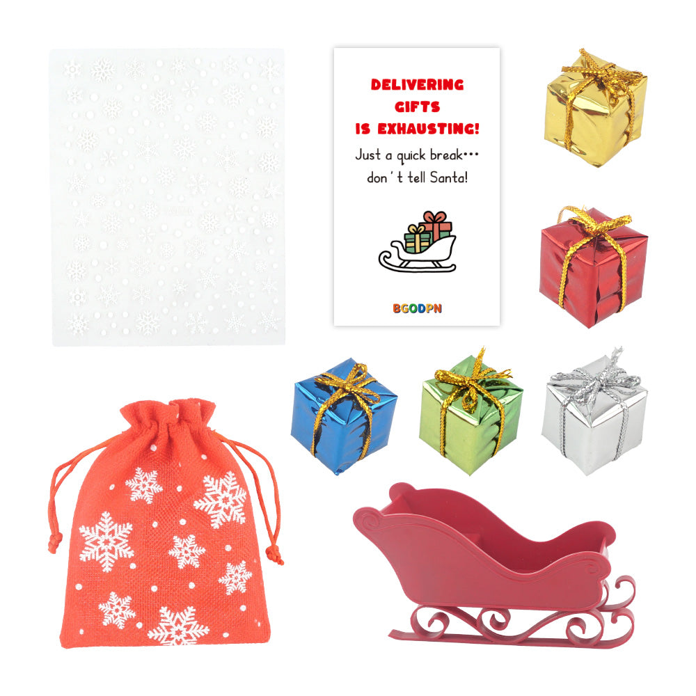 Christmas elf prop set with red sleigh, gift bag, mini gift boxes, snowflake stickers, and activity card for holiday elf scene display
